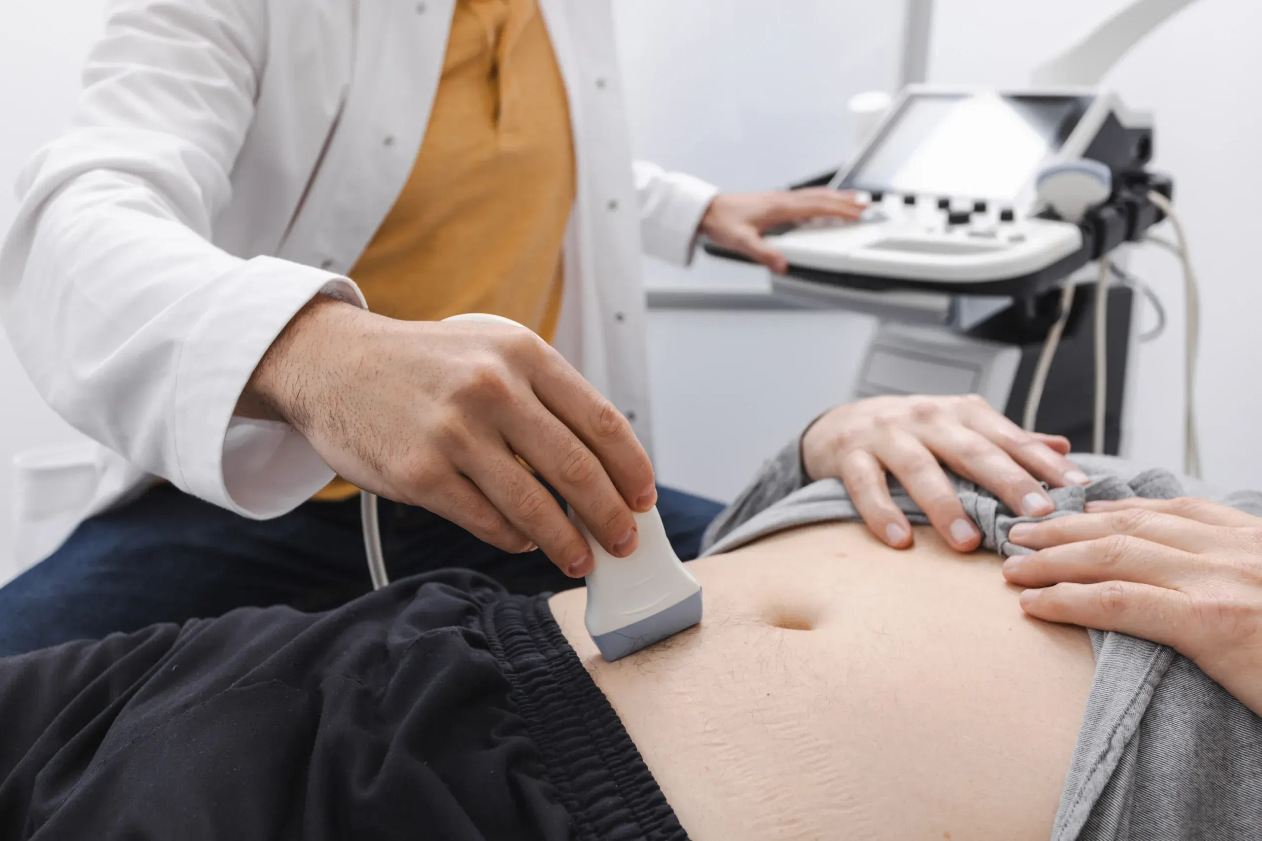 Patient receiving a non-invasive bladder scan at Zabinski Urology in Melbourne, FL