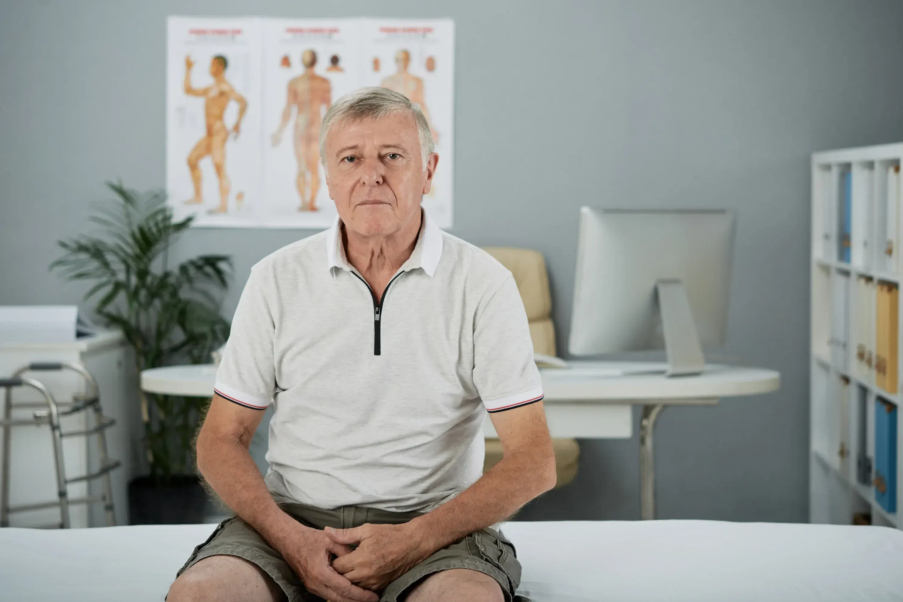 Doctor explaining the biological causes and risk factors of erectile dysfunction to a male patient