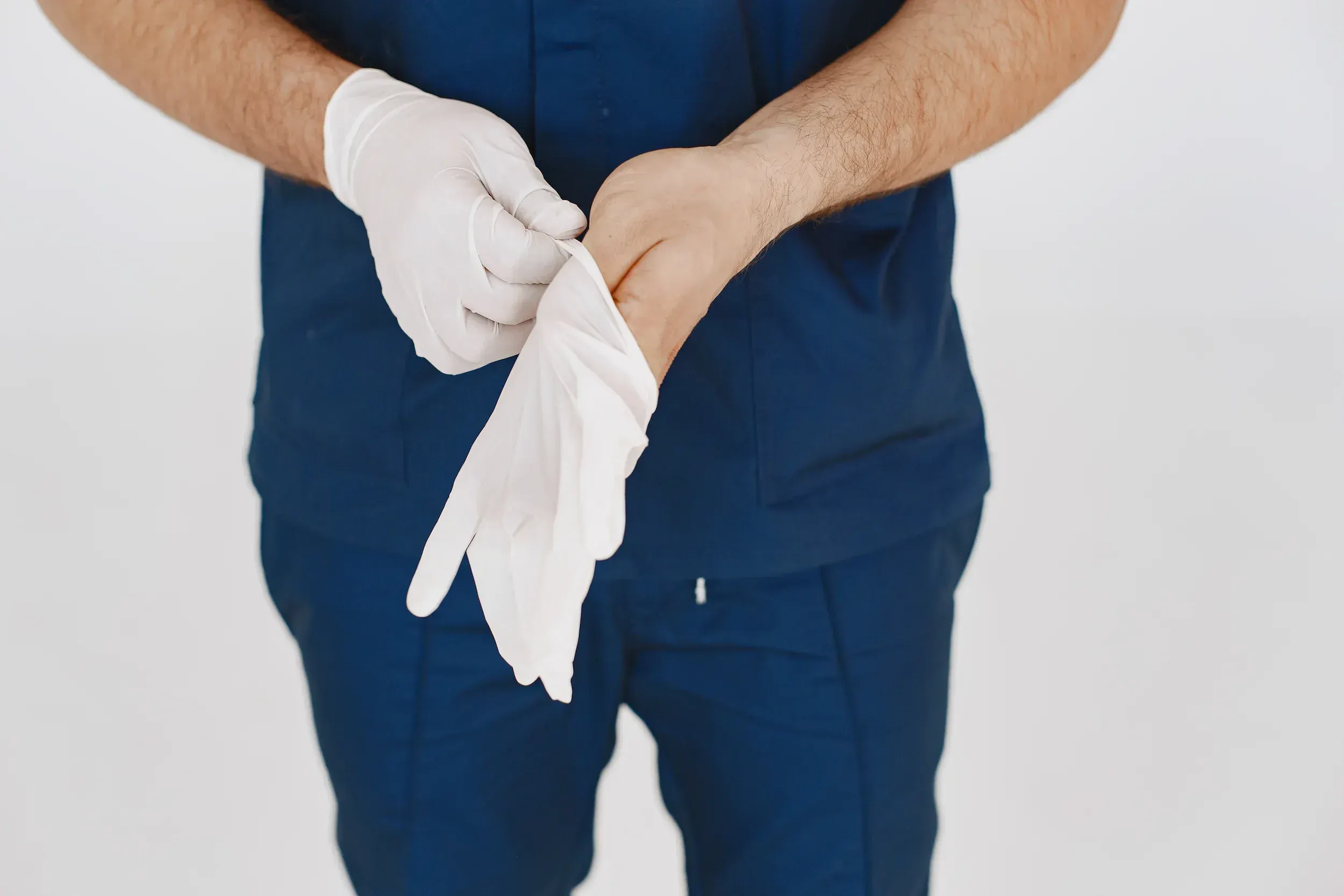 Board-certified urologist consulting with a male patient about scrotal health at Zabinski Urology in Melbourne, FL